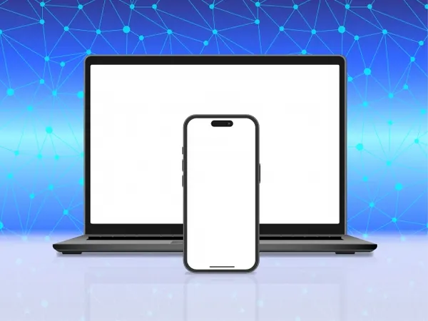 ネットワーク模様を背景に置かれたノートパソコンとスマートフォン